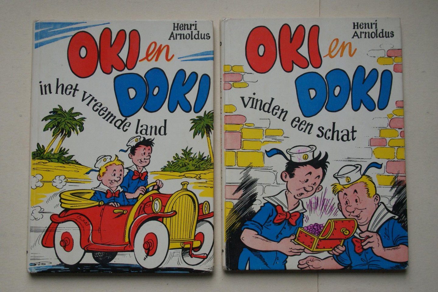 Arnoldus, Henri - 2 boeken samen: OKI en DOKI IN HET VREEMDE LAND   &   OKI en DOKI VINDEN EEN SCHAT  door: Henri Arnoldus
