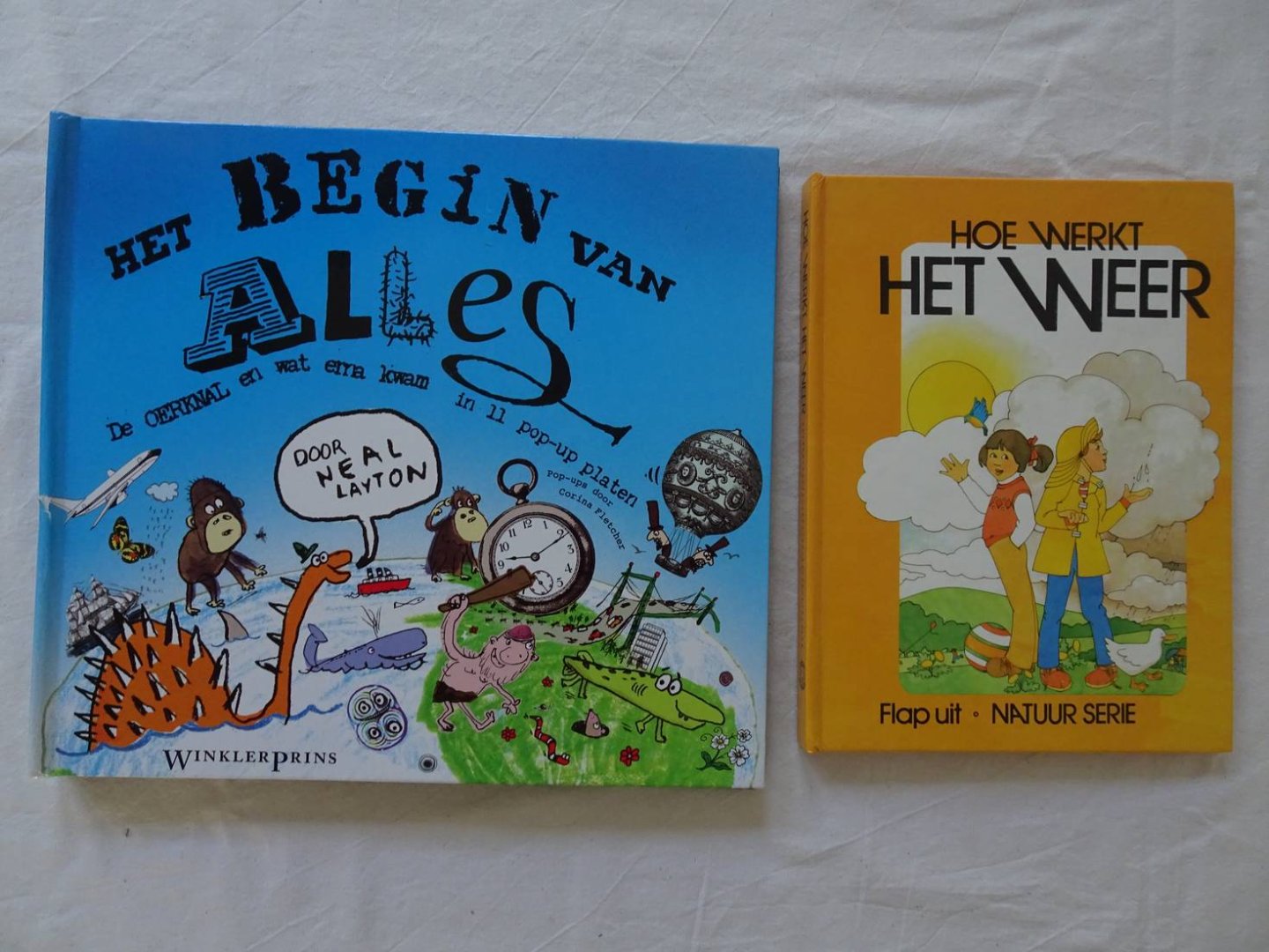 Seymour, Peter & Neal Layton. - Hoe werkt het weer. Flap uit. Natuur serie/ Het begin van alles. De oerknal en wat erna kwam in 11 pop-up platen. 2 titels.