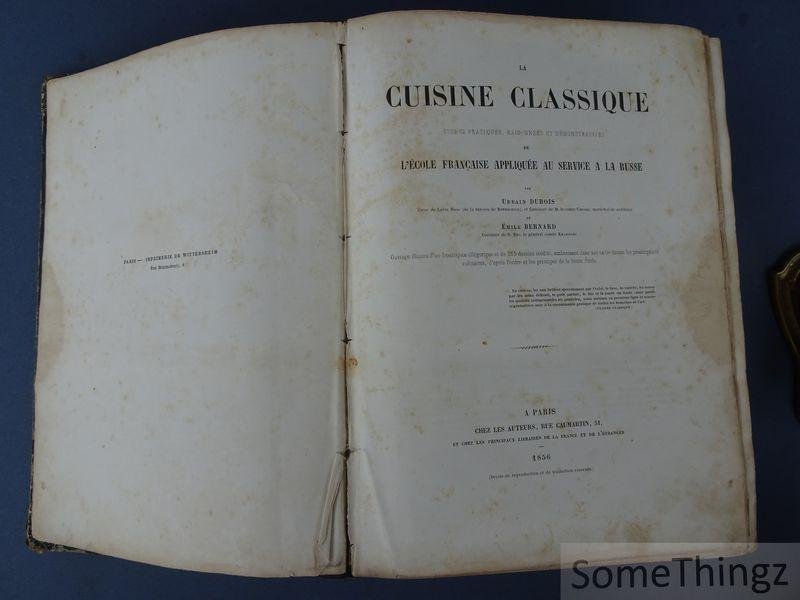 Dubois, Urbain et Bernard, Emile. - La cuisine classique. Etudes pratiques, raisonnees et demonstrative de L'Ecole Française appliquee au Service a la Russe. Ouvrage illustre d'un frontispice allegorique et de 215 dessins inedits, embrassant dans son cadre toutes les prescriptio...