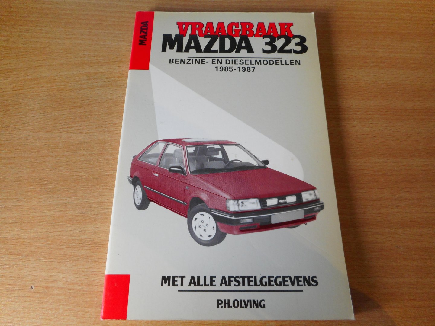 Olving, P.H. (red.) - Vraagbaak Mazda 323 benzine- en dieselmodellen 1985-1987