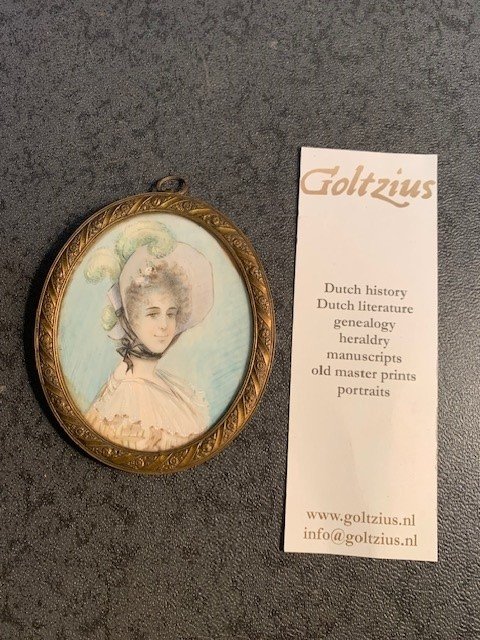  - Attractive miniature portrait of a woman with a hat with feathers and in beatiful dress painted on ivory.