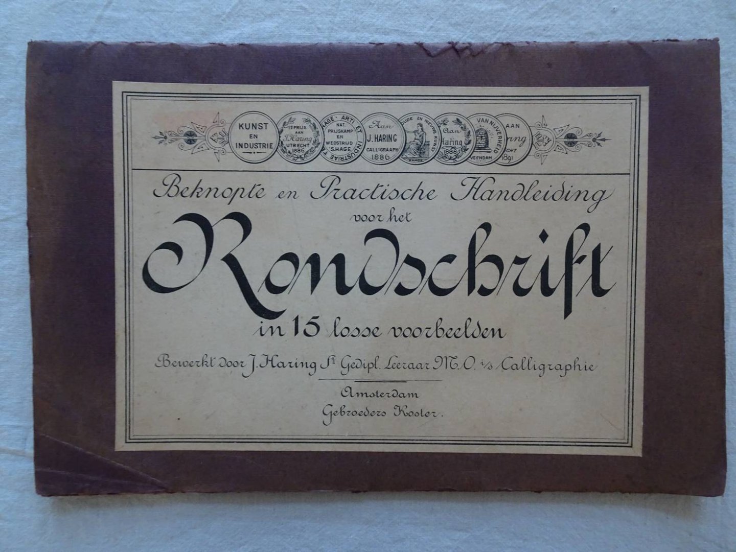 Haring jr., J.. - Beknopte en practische handleiding voor het rondschrift in 15 losse voorbeelden.