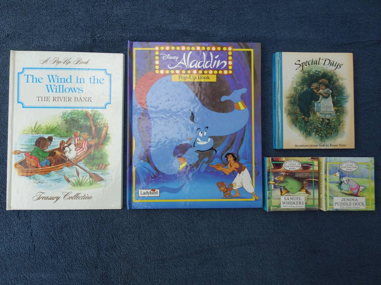 Nister, Ernest, Beatrix Potter & Walt Disney. - Special Days/ Samuel Whiskers. Beatrix Potter little hide-and-seek books. With sliding pictures/ Jemma Puddle-Duck. Beatrix Potter little hide-and-seek books. With sliding pictures/ The Wind in the Willows. The River Bank. A pop-up book/ Aladd...