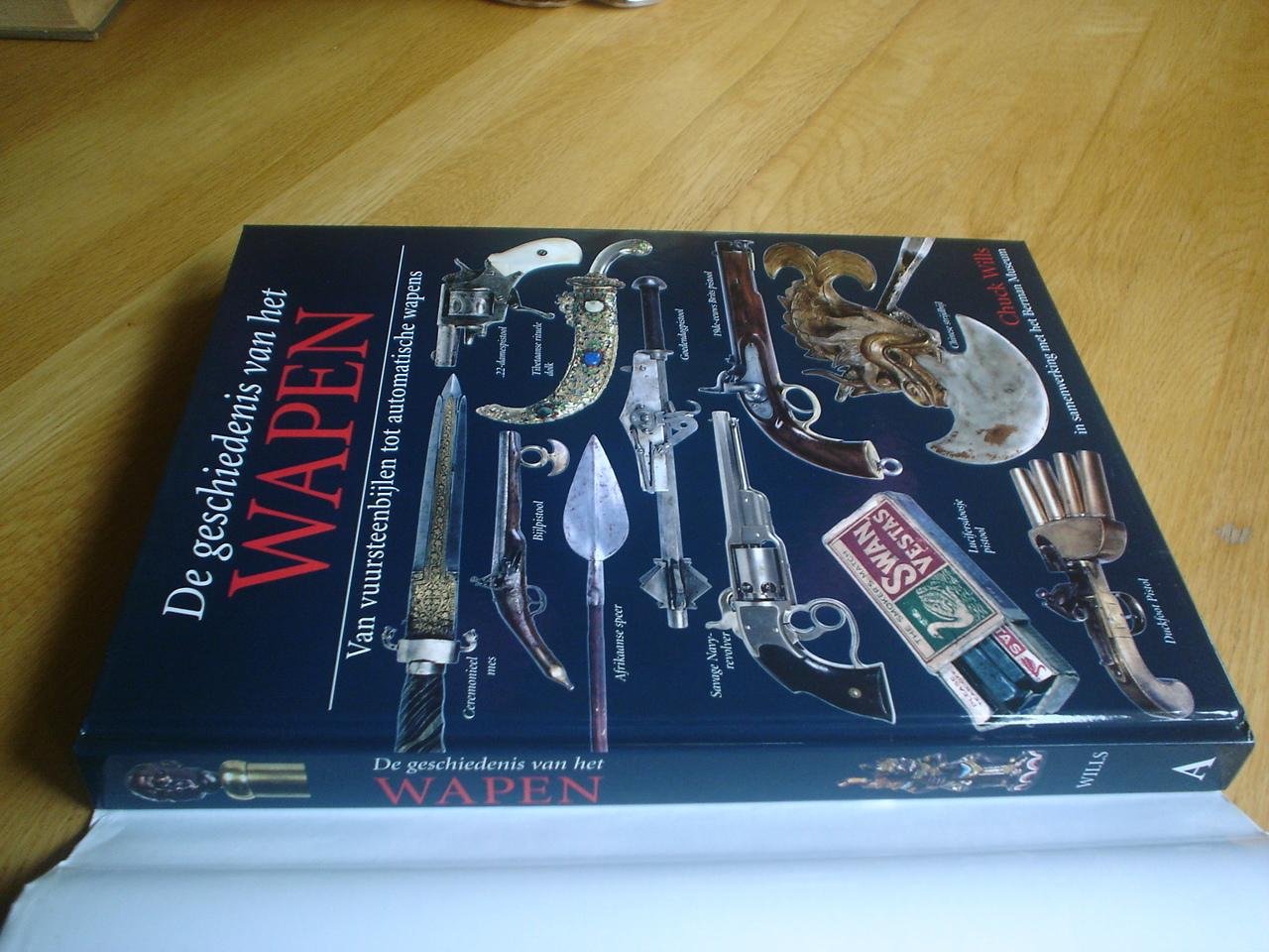 Wills, Chuck. - De geschiedenis van het wapen / van vuursteenbijlen tot automatische wapens
