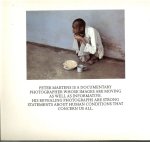 Martens, Peter Designed by J.A.M. Rotterdam en John van Leeuwen met 74 kleuren foto's en achterin  wat het is - Cruel compassion