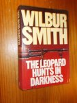 SMITH, WILBUR, - The leopard hunts in darkness.