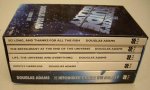ADAMS, DOUGLAS. - The Hitchhiker's Guide to the Galaxy / The Restaurant at the End of the Universe / Life, the Universe and Everything / So Long, and Thanks for all the Fish / Mostly Harmless.  [5 Book Set in the original Slipcase].