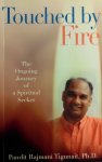 Tigunait, Pandit Rajmani . [ isbn 9780893892395 ]  ( Het boek is gesigneerd met een opdracht . ) - Touched by Fire . ( The Ongoing Journey of a Spiritual Seeker . )  The autobiography of Pandit Rajmani Tigunait. Provides tremendous insights to Eastern culture and traditions . )