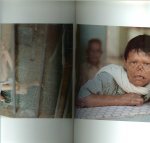 Martens, Peter Designed by J.A.M. Rotterdam en John van Leeuwen met 74 kleuren foto's en achterin  wat het is - Cruel compassion