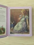 Carroll, Lewis, Tenniel, John (ills.) Matsier, Nicolaas (vertaling) - Alice in Wonderland  Puzzelboek Met zeven puzzels van 48 stukjes