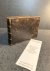  - BUCQUOY, DE; DE SMETH; DE LEEUW--- Familieboekje met aantekeningen uit de jaren 1609 tot 1715, in het Frans en in het Nederlands, betreffende de families De Bucquoy en De Smeth. Ca. 100 beschreven pagina's in een oblong, in leer gebonden, boek...