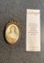  - Attractive miniature portrait of a woman with curly hair and in beatiful classical dress painted on ivory.